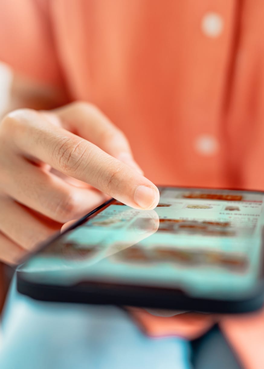 Close-up of person browsing online store on phone